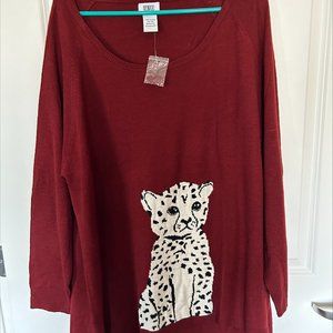 Long sleeve sweater with animal on front.